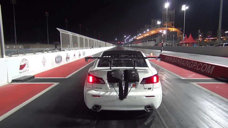 Race car takes flight and jumps a safety barrier