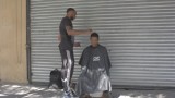 barber gives the homeless free haircuts